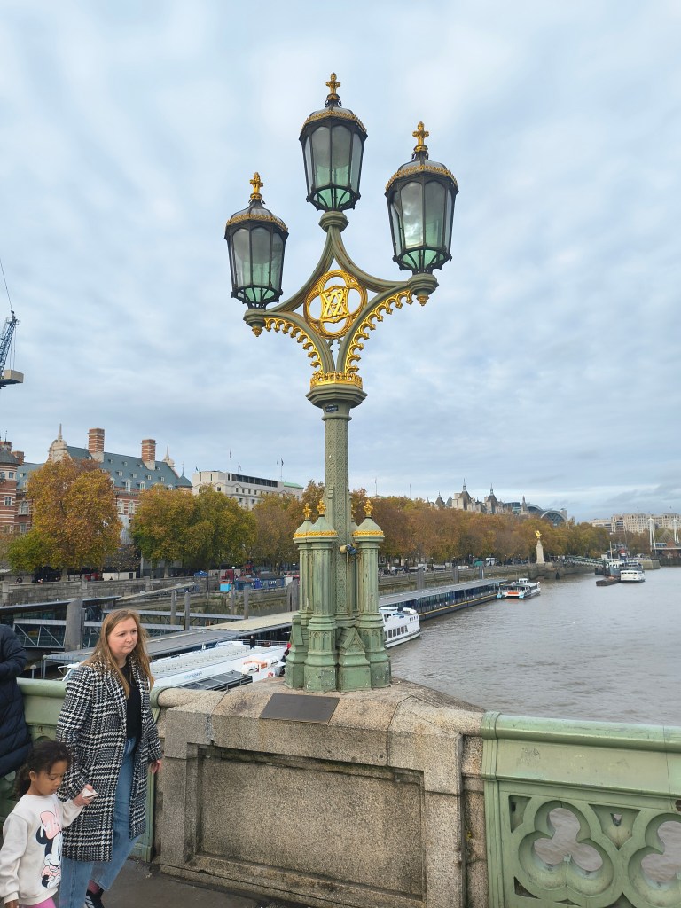 Westminster Pier showing an ornate street lamp